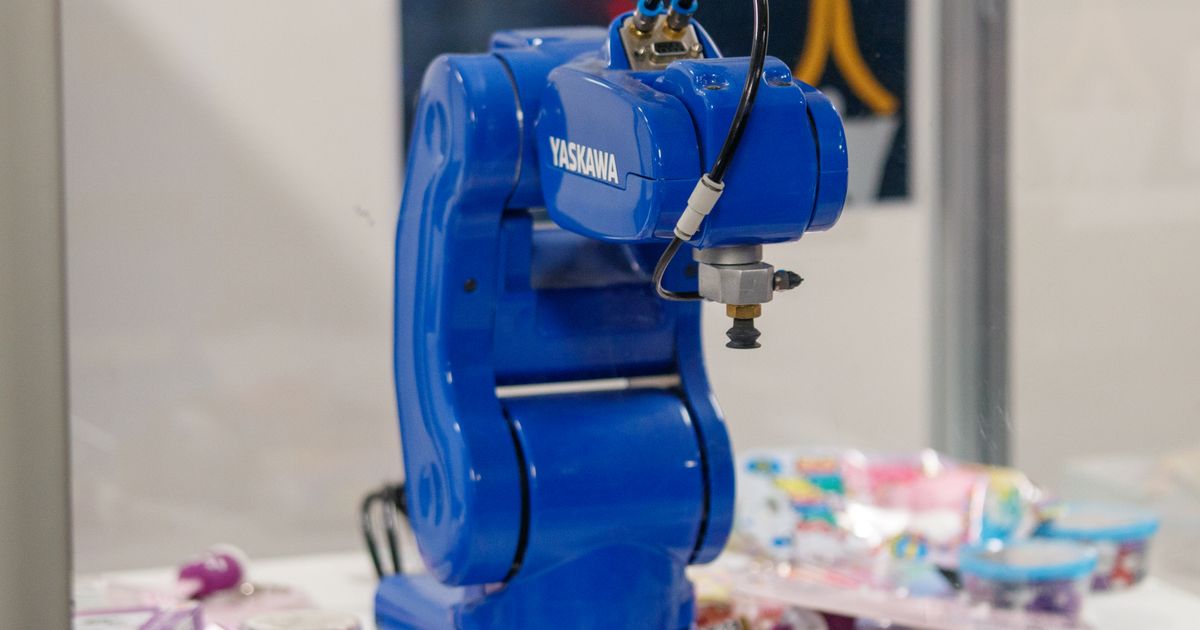 An industrial robot arm on a workbench