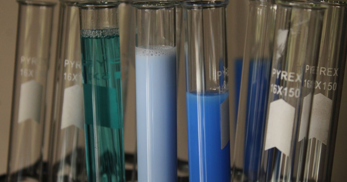Rows of laboratory test tubes in a rack